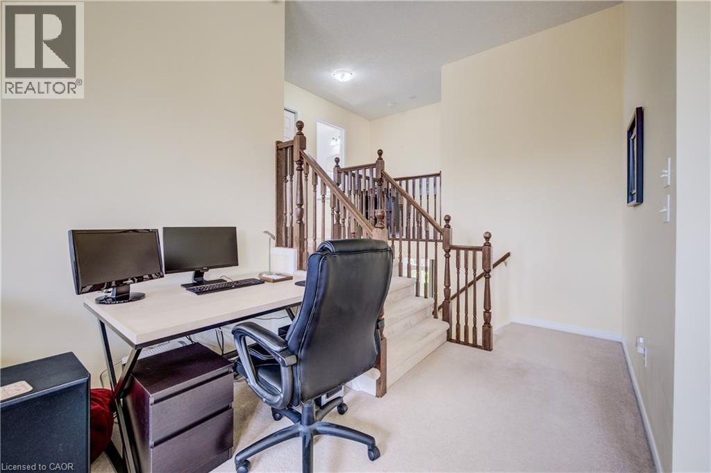 Carpeted flooring, painted walls, wood baluster staircase - 64 Kropf Drive, Baden, ON - Indoor Photo Showing Office