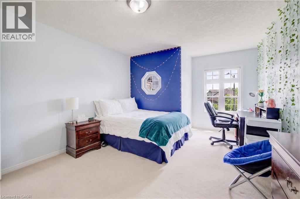 Carpeted room featuring a double window,, and a ceiling light - 64 Kropf Drive, Baden, ON - Indoor Photo Showing Bedroom