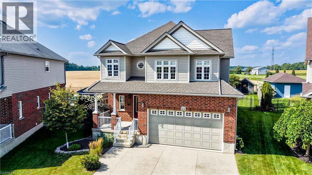 Two-story residence featuring a brick and siding exterior, an attached two-car garage, covered front porch, and a concrete driveway - 64 Kropf Drive, Baden, ON - Outdoor