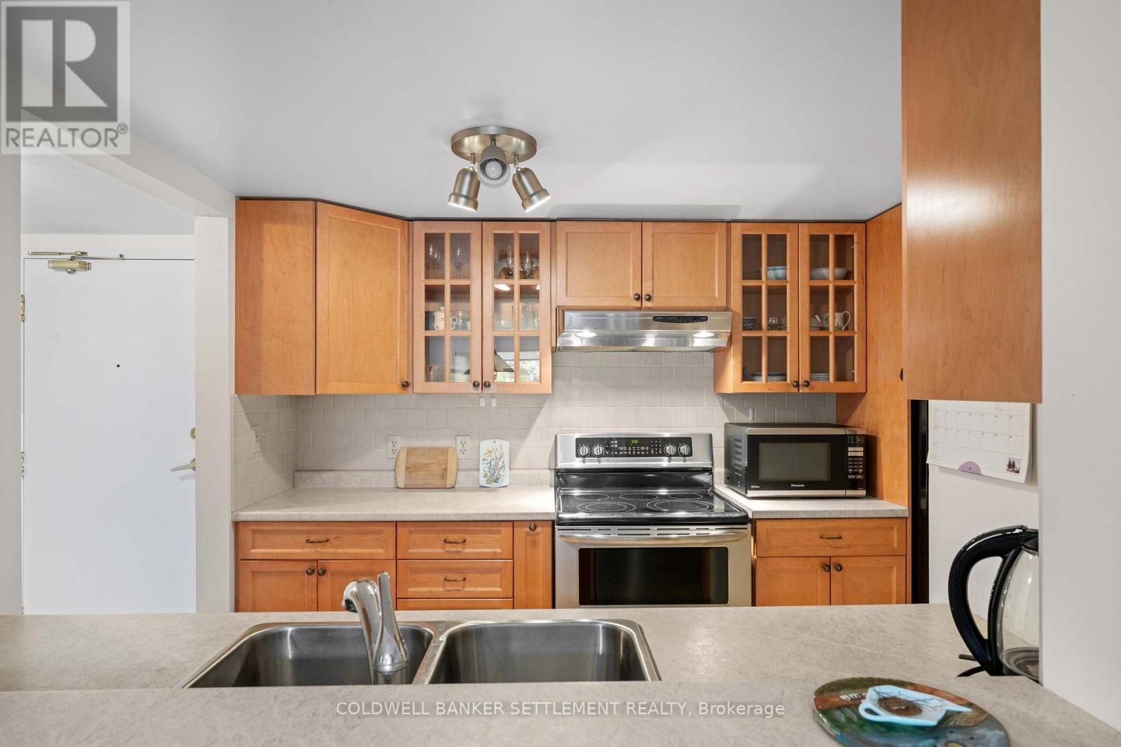 207 - 23 Rogers Road, Perth, ON - Indoor Photo Showing Kitchen With Double Sink