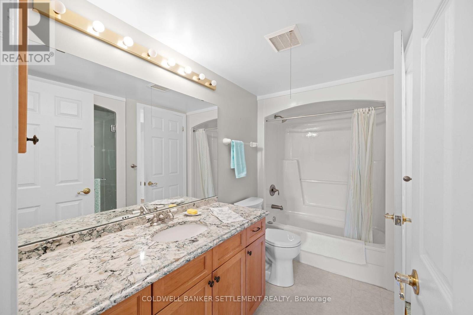Tub and walk in shower in bathroom - 207 - 23 Rogers Road, Perth, ON - Indoor Photo Showing Bathroom