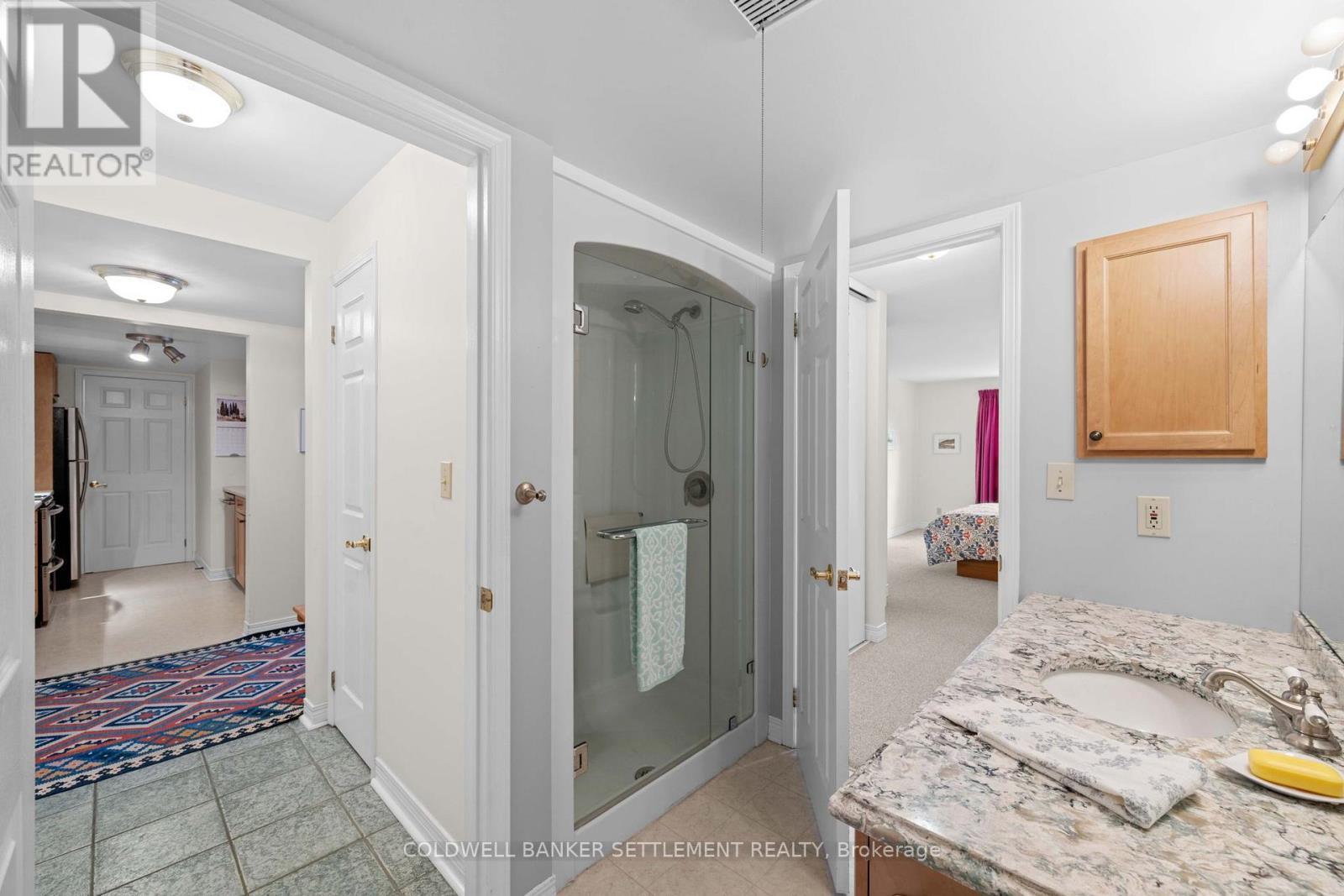 Walk in shower, door to primary bedroom and hal - 207 - 23 Rogers Road, Perth, ON - Indoor
