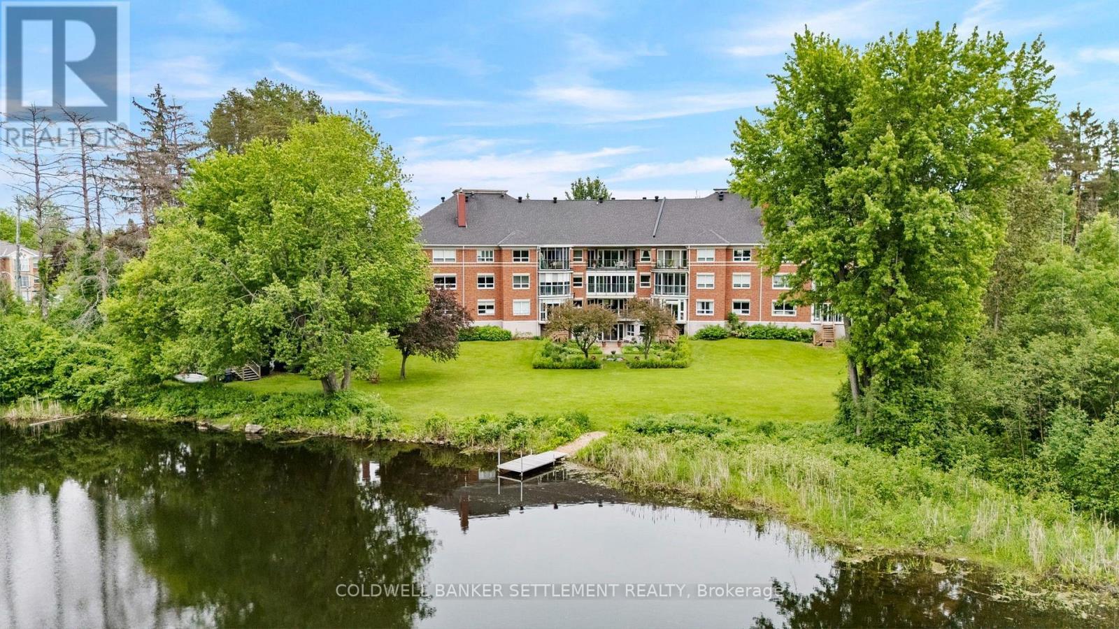 Back of the building from the Tay River - 207 - 23 Rogers Road, Perth, ON - Outdoor