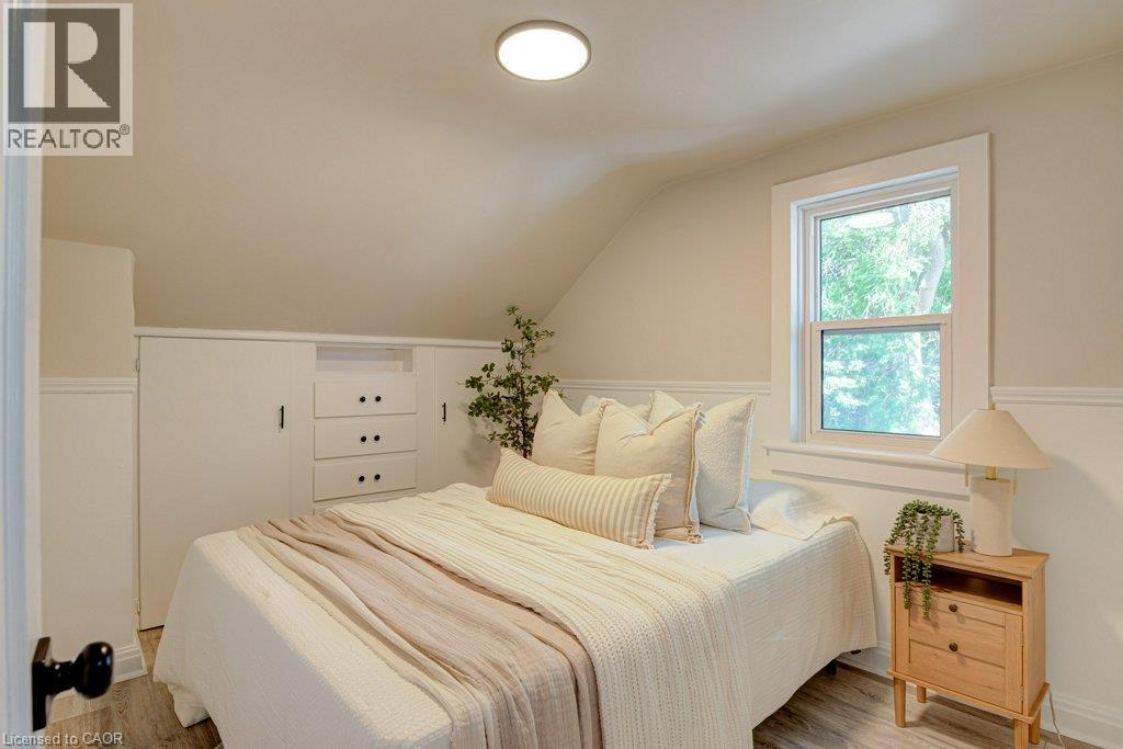 Sloped ceiling detail with recessed lighting, single window, and integrated built-in storage - 99 Shantz Lane, Kitchener, ON - Indoor Photo Showing Bedroom