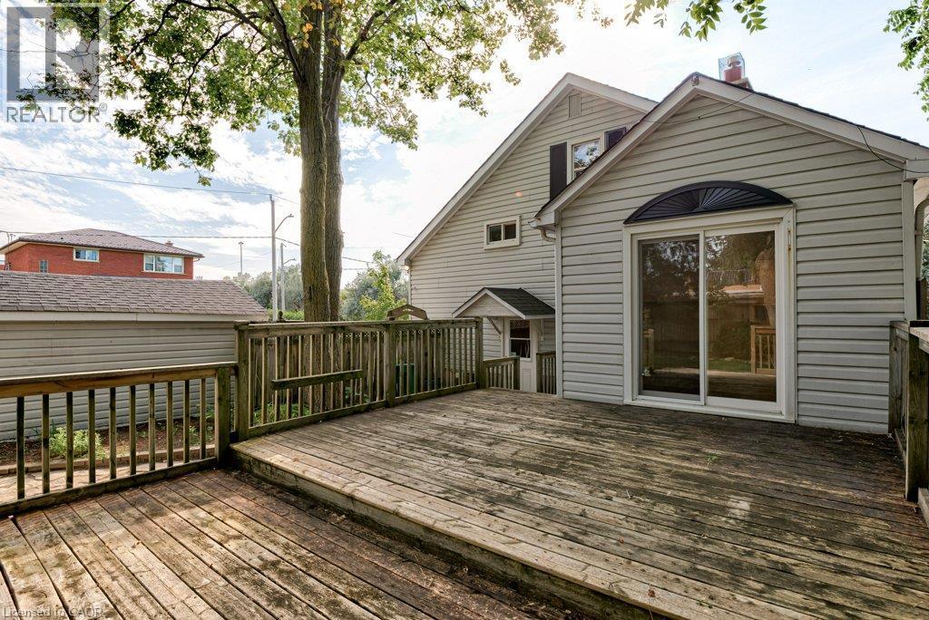Expansive wood deck with railing and direct access to the home via sliding glass doors - 99 Shantz Lane, Kitchener, ON - Outdoor With Deck Patio Veranda With Exterior
