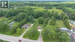 Expansive property featuring mature trees and a manicured lawn -
