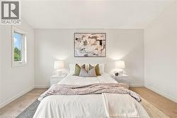 Carpeted flooring, white walls, and a single window with white trim - 