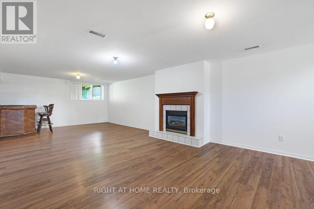 Cozy Fireplace for Cool Nights! - 53 Yoho Drive, Ottawa, ON - Indoor Photo Showing Living Room With Fireplace