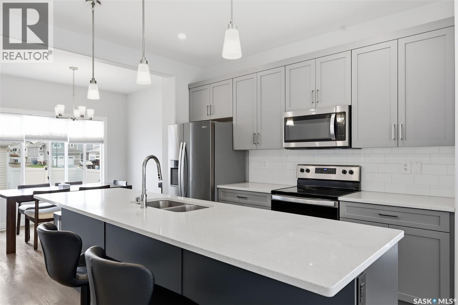 122 Taskamanwa Street, Saskatoon, SK - Indoor Photo Showing Kitchen With Double Sink With Upgraded Kitchen