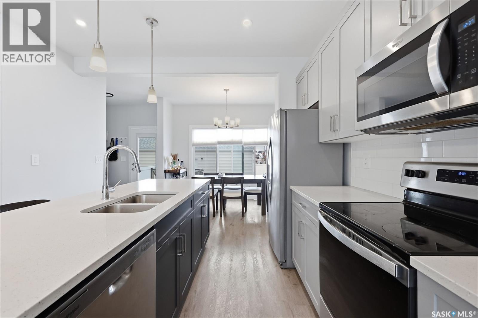 122 Taskamanwa Street, Saskatoon, SK - Indoor Photo Showing Kitchen With Double Sink