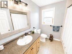 Vanity with a built-in sink and stone-look countertop -