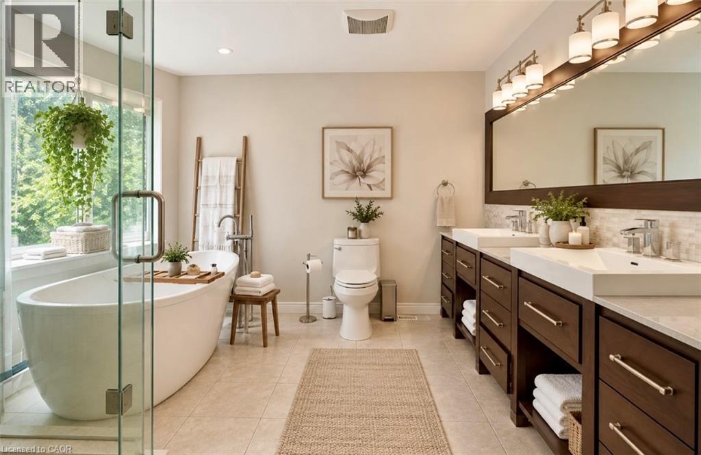 Freestanding soaking tub with a large window, glass-enclosed shower, dual vanity with undermount sinks, and tile flooring - 56 Windrush Trail, Kitchener, ON