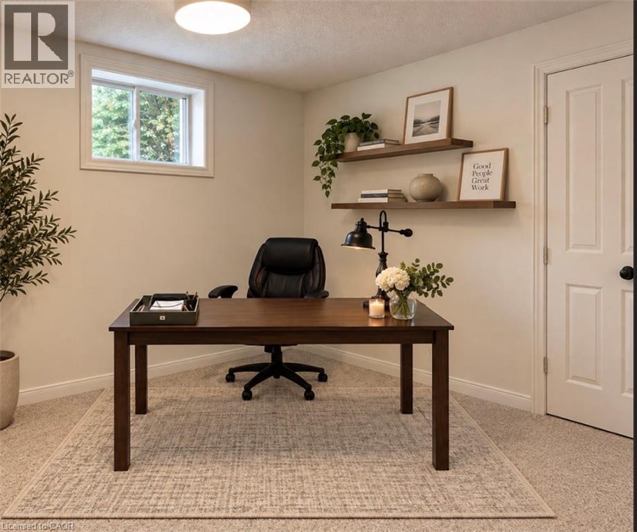 Recessed window with white trim, wall-mounted shelving, overhead flush-mount lighting, and carpeted flooring - 56 Windrush Trail, Kitchener, ON