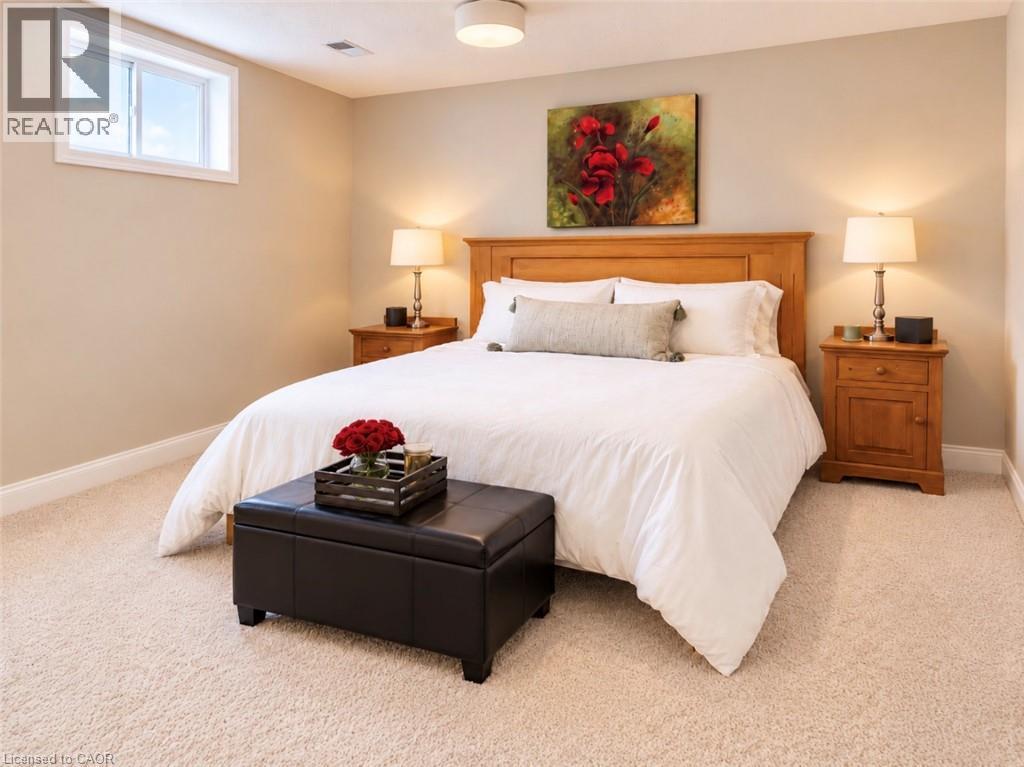 Warm neutral wall tones with plush carpet flooring - 56 Windrush Trail, Kitchener, ON