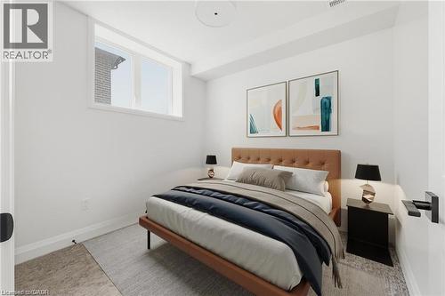 Recessed ceiling light, white painted walls, and a single horizontal window - 36 Elliott Street Unit# 1, Cambridge, ON 