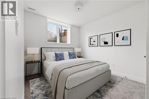 White walls, recessed lighting, and a window providing natural light - 36 Elliott Street Unit# 1, Cambridge, ON 