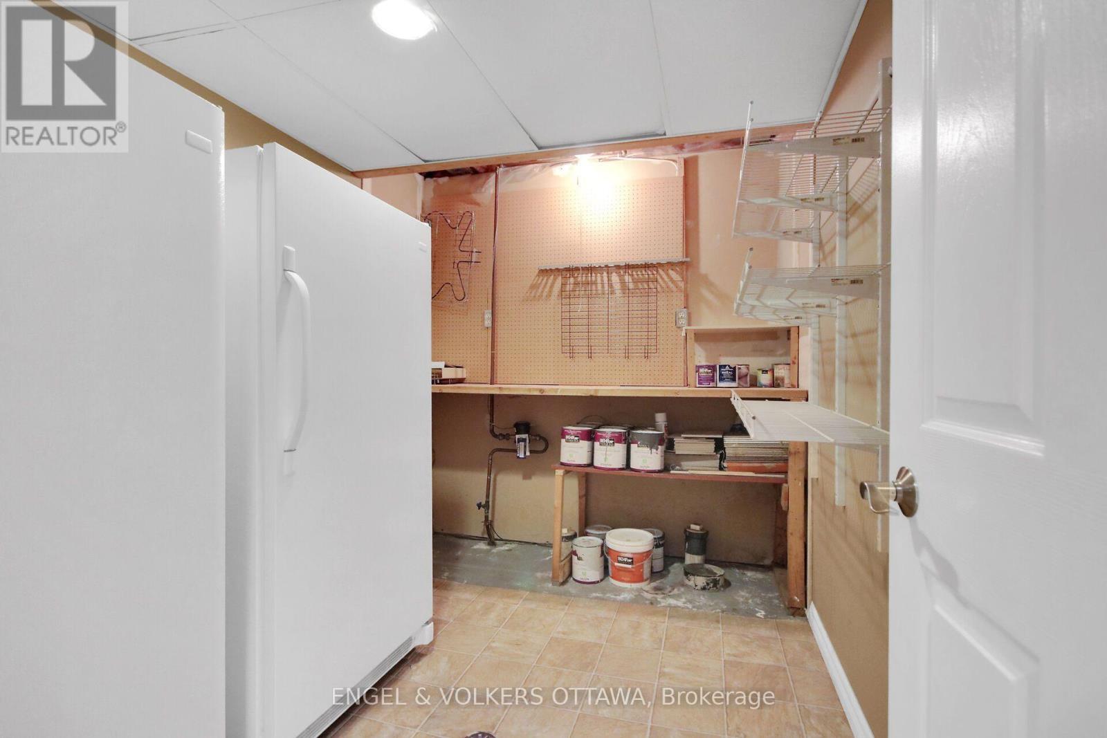 Workshop area with a full fridge & full freezer. - 24 Tammela Court, Ottawa, ON