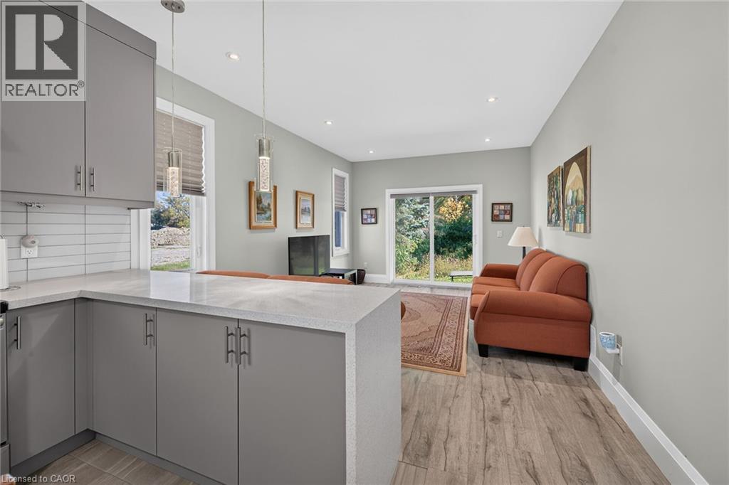 Contemporary kitchen with gray cabinetry, white countertops, and a subway tile backsplash - 41 Eleanor Avenue, Hamilton, ON