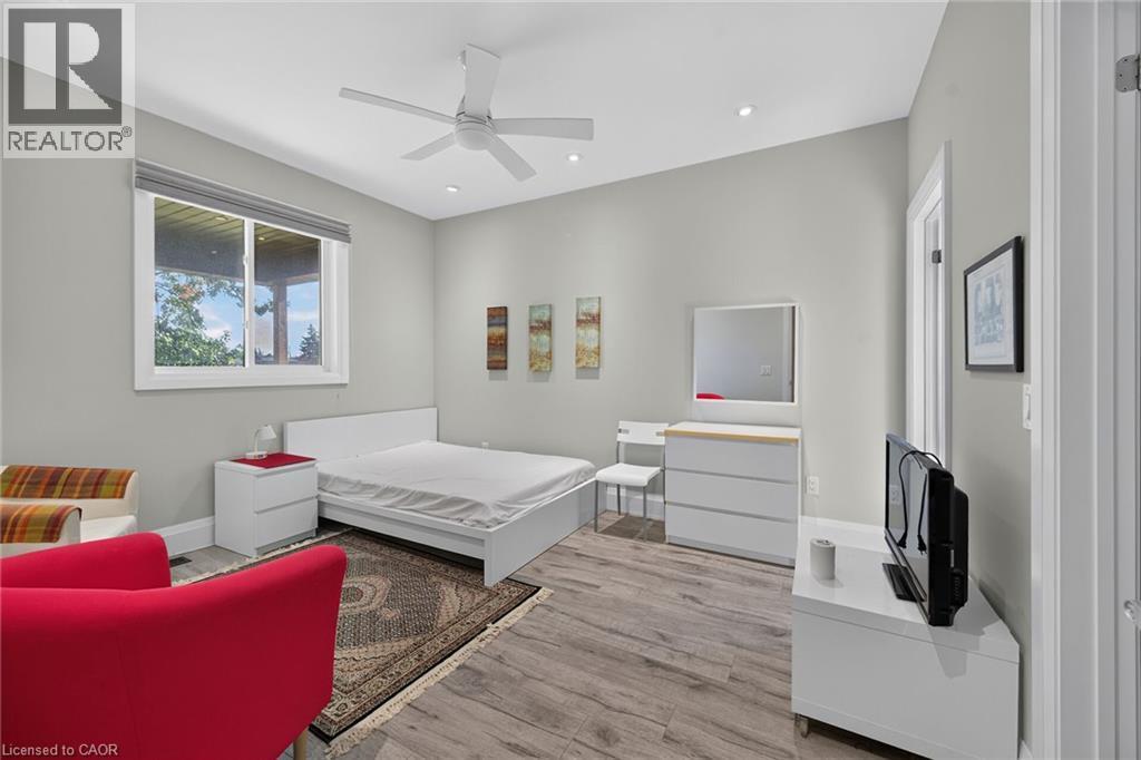 Wood-finish flooring, recessed lighting, and a ceiling fan - 41 Eleanor Avenue, Hamilton, ON