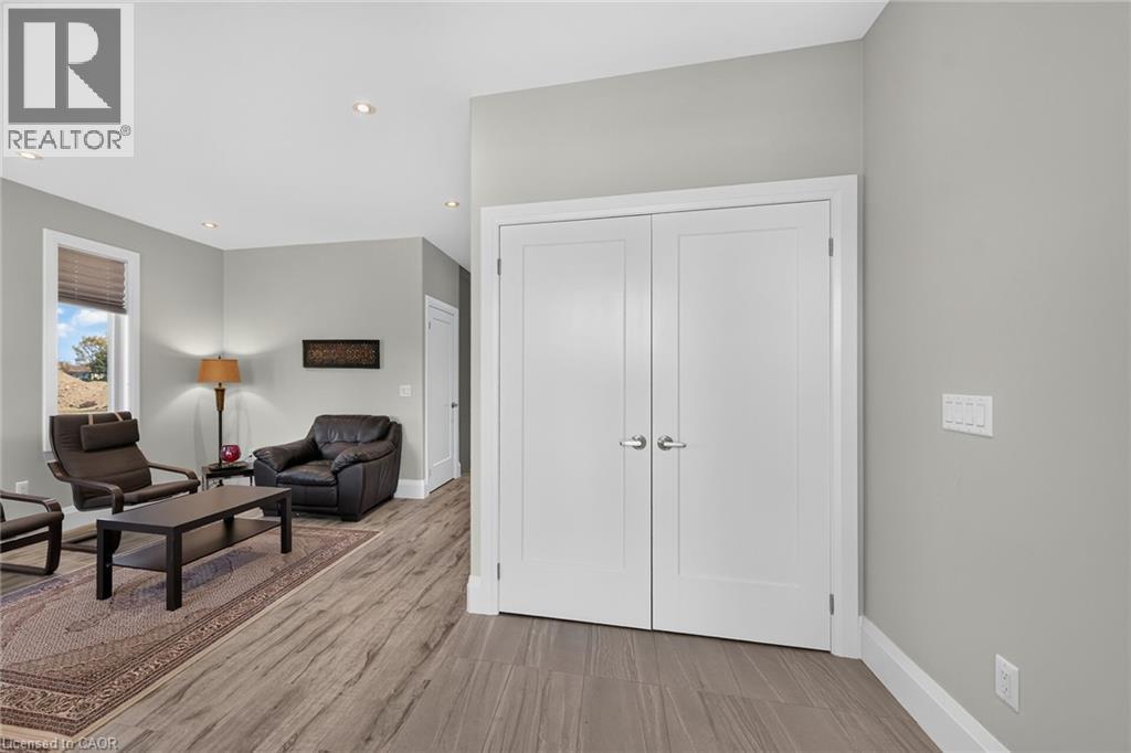 Recessed ceiling lighting, wood-finish flooring, light gray wall paint, and white trim - 41 Eleanor Avenue, Hamilton, ON