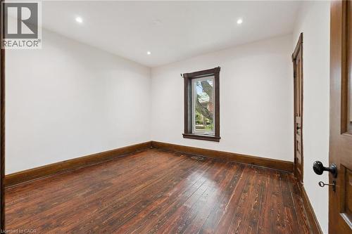 Room featuring wood-finish flooring, white walls, and recessed lighting - 245 Lowther Street S, Cambridge, ON 