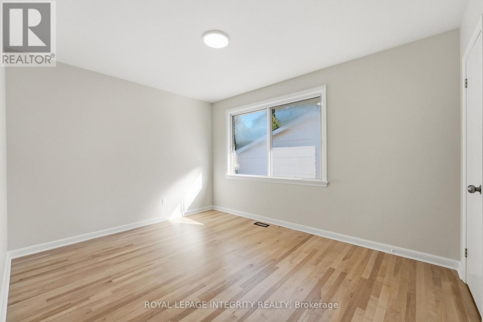 Bedroom with large window, plenty of natural light - 2007 Dorval Avenue, Ottawa, ON