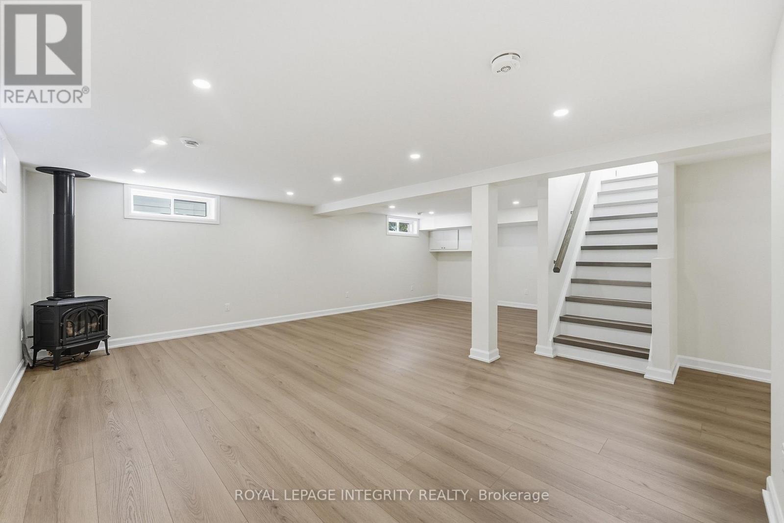 Lower level family room with gas fireplace - 2007 Dorval Avenue, Ottawa, ON