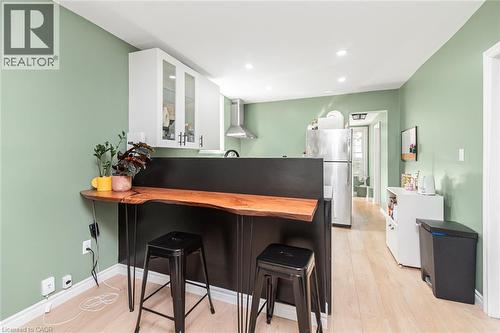 Wood-finish flooring throughout - 29 Wexford Avenue N, Hamilton, ON 