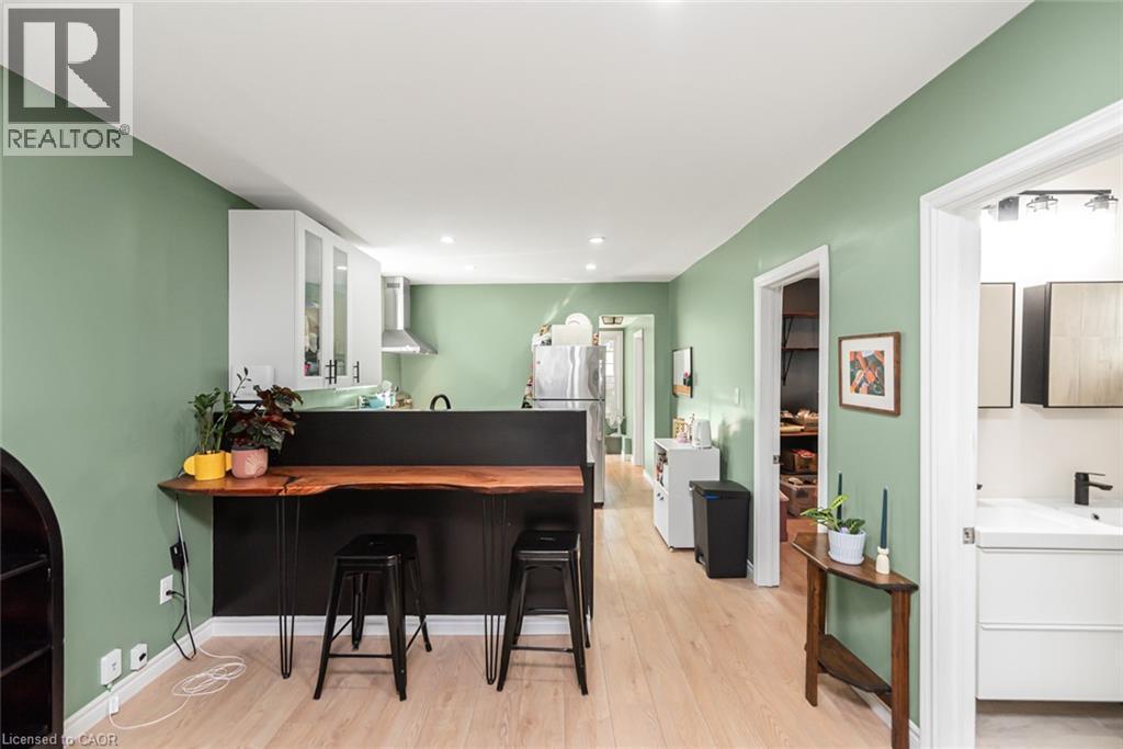 Kitchen with white upper cabinetry and stainless steel appliances - 29 Wexford Avenue N, Hamilton, ON