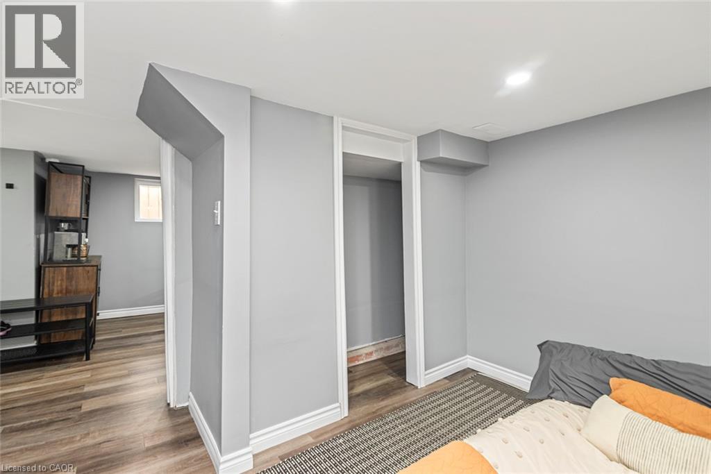 Recessed lighting and wood-finish flooring - 29 Wexford Avenue N, Hamilton, ON