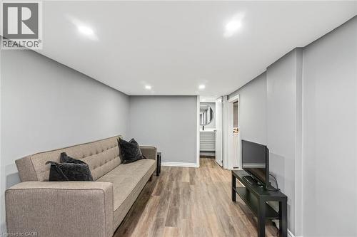 Recessed ceiling lighting, wood-finish flooring, and light gray wall paint - 29 Wexford Avenue N, Hamilton, ON 