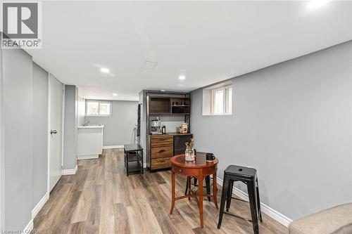 Wood-finish flooring throughout, recessed lighting, and light gray wall paint - 29 Wexford Avenue N, Hamilton, ON 