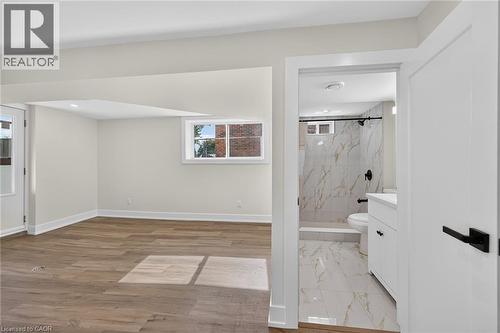 Wood-finish flooring, recessed lighting, and a white trim package - 331 East 17Th Street, Hamilton, ON 