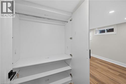 Built-in closet with hanging rod and multiple shelves - 331 East 17Th Street, Hamilton, ON 