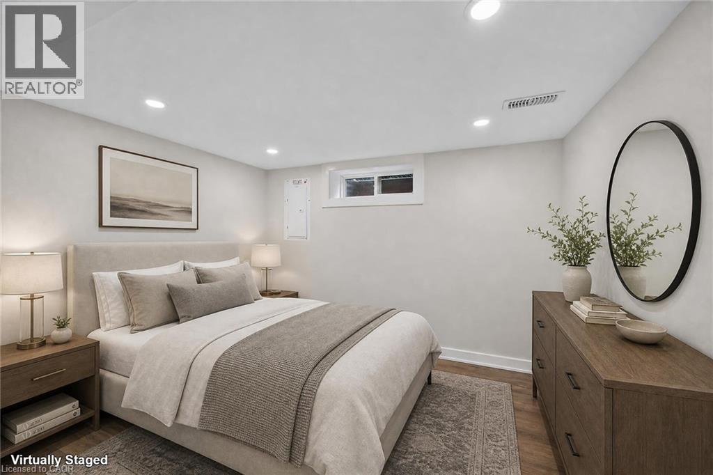 Recessed lighting, wood-finish flooring, white walls, and a low-profile window - 331 East 17Th Street, Hamilton, ON