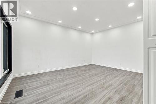 Recessed ceiling lighting, crown molding, wood-finish flooring, and white walls - 246 Hillcrest Road, Cambridge, ON 