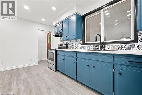 Wood-finish flooring with white walls and recessed lighting - 246 Hillcrest Road, Cambridge, ON 