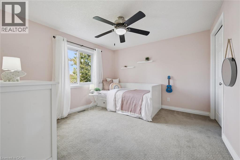 Second bedroom with window and light-toned carpet - 6 Branwood Place, Kitchener, ON