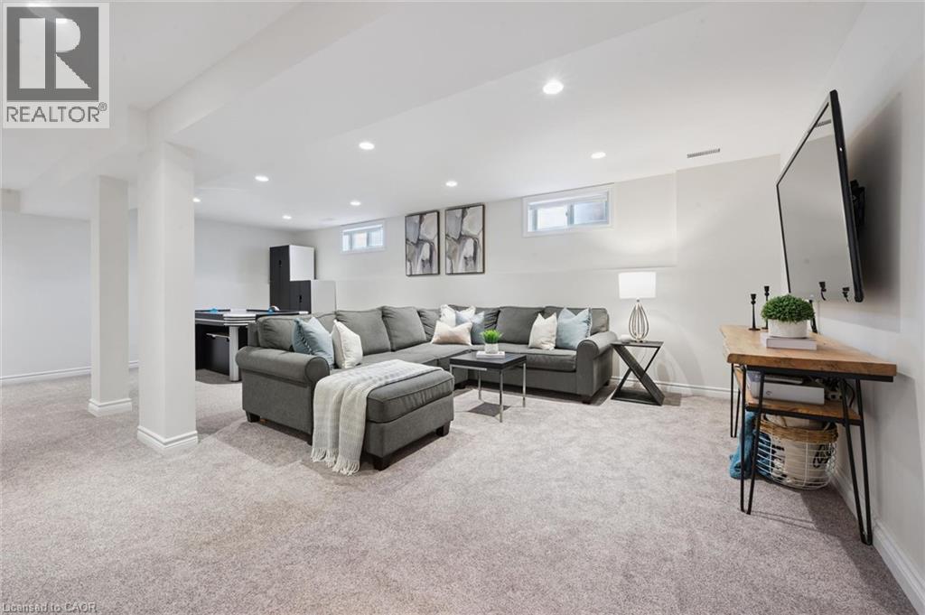 Finished lower level with recessed lighting, light-toned carpeting - 6 Branwood Place, Kitchener, ON