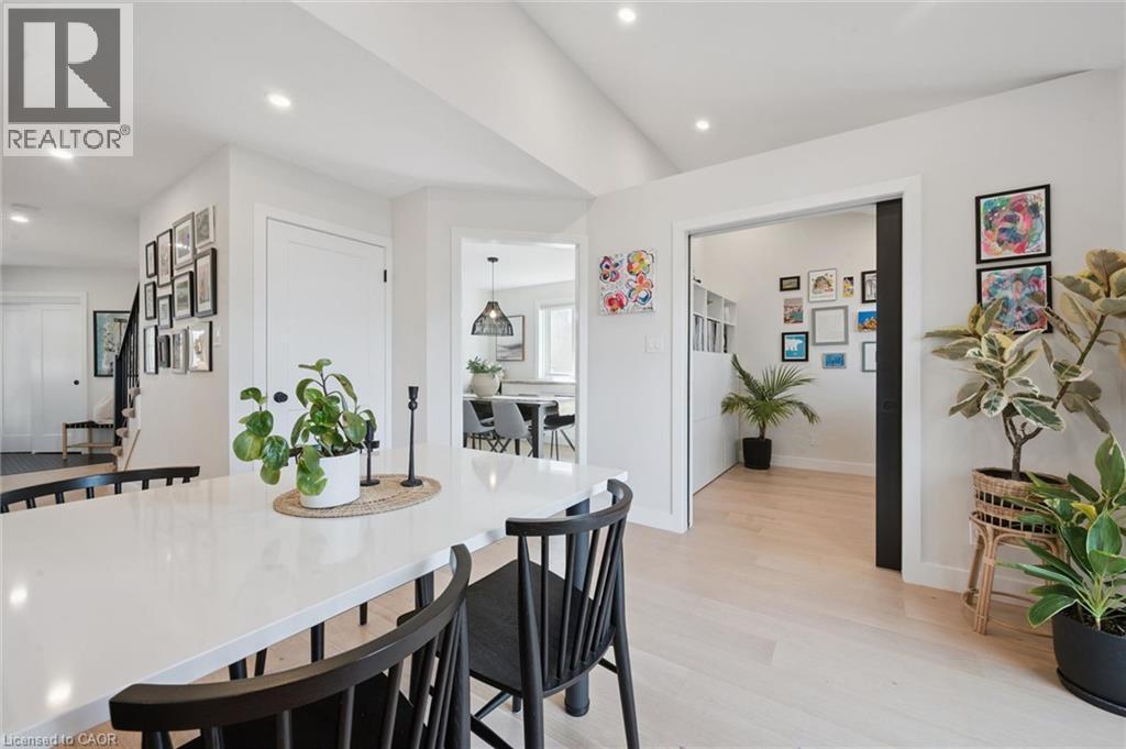 Crisp white walls, light wood-finish flooring, recessed lighting, and a white countertop - 6 Branwood Place, Kitchener, ON