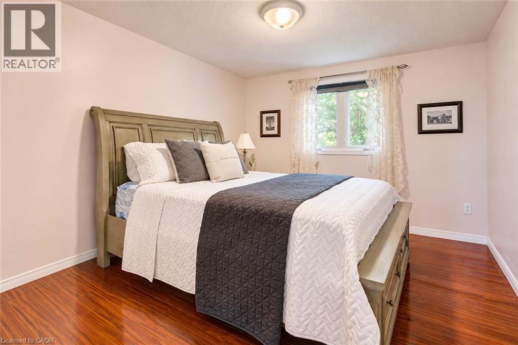 Wood-finish flooring with a white trim - 327 Oprington Place, Kitchener, ON