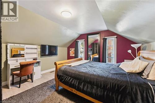 Sloped ceilings with recessed lighting, light wood-finish flooring, and dual casement windows - 74 Selkirk Street, Cambridge, ON 