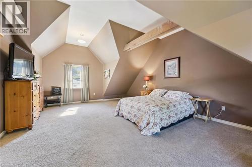 Vaulted ceiling, exposed wood beams, window with drapes, wall-to-wall carpeting, overhead lighting fixture - 74 Selkirk Street, Cambridge, ON 