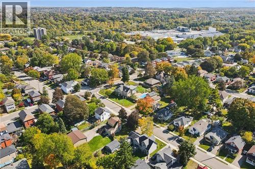 Residential neighborhood featuring mature trees, diverse architectural styles, paved streets, and a distant commercial area - 74 Selkirk Street, Cambridge, ON 