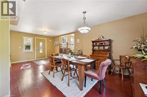 Wood-finish flooring throughout, complemented by warm-toned wall paint and white trim - 74 Selkirk Street, Cambridge, ON 