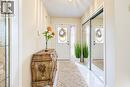 Foyer with tile floors and large closet - 11 Peregrine Crescent, Cambridge, ON 