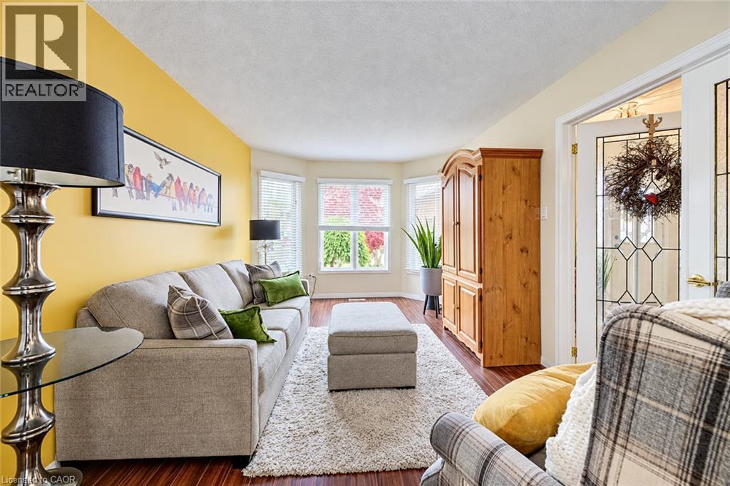 Formal living room with large window. - 11 Peregrine Crescent, Cambridge, ON