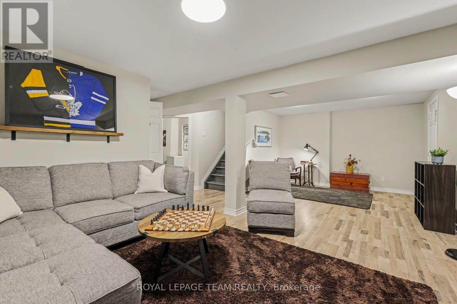 Family room in basement: newer flooring! - 4 Degas Court, Ottawa, ON
