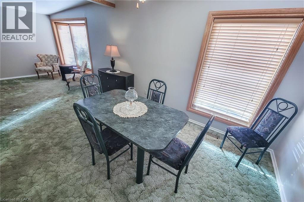 Dedicated dining area with plenty of natural light and easy access to the adjoining living space - 286 Mohawk Road W, Hamilton, ON