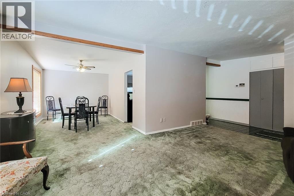 Spacious living and dining areas with a practical layout for everyday living and entertaining - 286 Mohawk Road W, Hamilton, ON